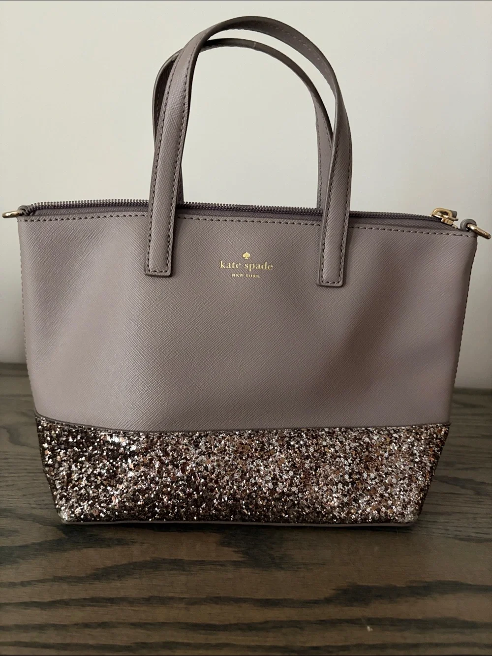 kate spade mauve tote with glitter bottom and gold logo